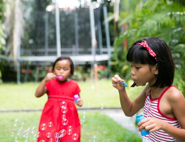 Sarah Salmon daughters blowing bubbles adopting babies in Asia