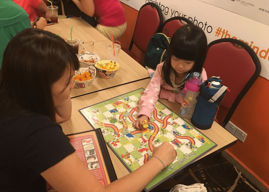 mum and daughter playing a board game