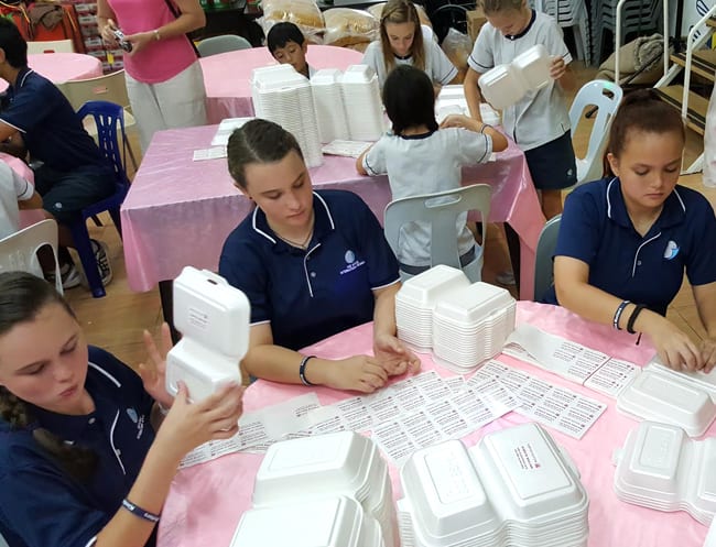 Students volunteering at Willing Hearts Soup Kitchen.