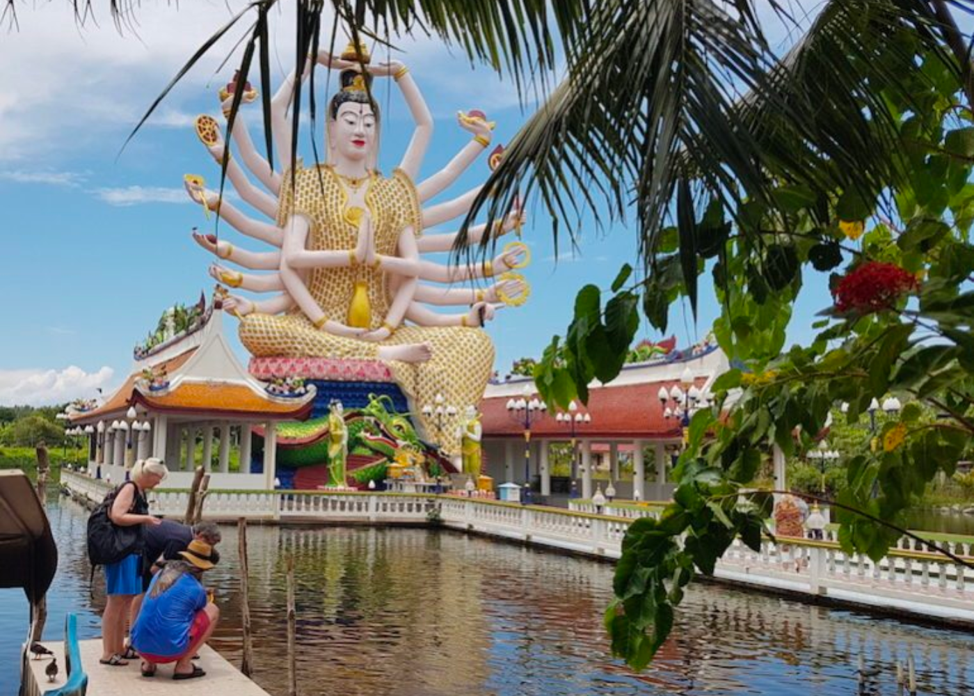 The whole fam loved feeding the fish at Wat Plai Laem. Photography: Jassmin Peter