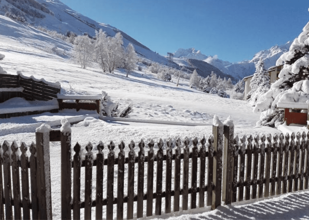 snow covered field with blue skies 