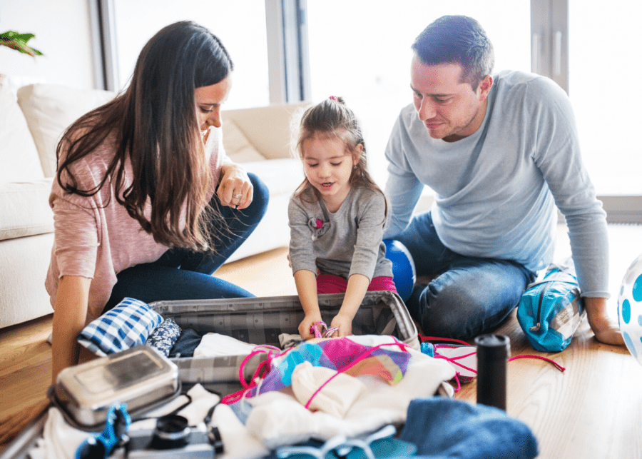 a-family-packing-their-luggage-for-travel