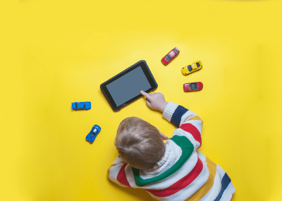 kid playing and watching on an ipad