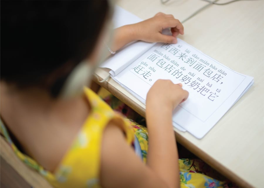 child studying Mandarin | White Lodge International Preschool & Childcare