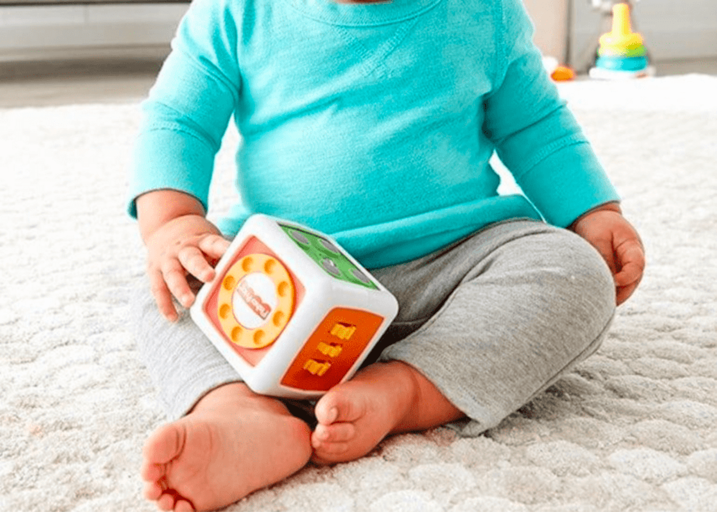 A toddler-sized fidget cube great for developing motor skills. Photography: Fisher Price